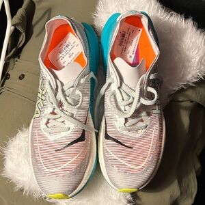 Hoka Athletic Shoes in White with Blue and Orange Highlights